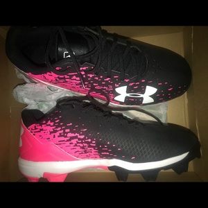 Black and pink UnderAmour  softball cleats